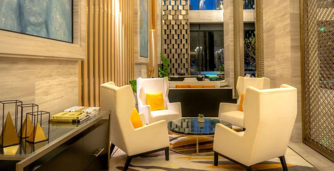 armchairs-and-table-in-hotel-lobby-cropped